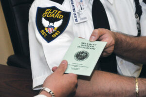 Security Services part of Elite Guards Security Guard Training looking at a Security Officer Handbook